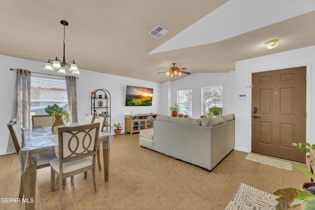 5609 Rick Husband Dr, El Paso, TX 79934 - dining space featuring vaulted ceiling, healthy amount of natural light, a chandelier, a ceiling fan, and a textured ceiling