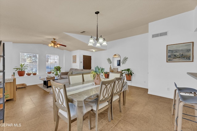 5609 Rick Husband Dr, El Paso, TX 79934 - dining room featuring ceiling fan, lofted ceiling, a chandelier, and light tile patterned flooring