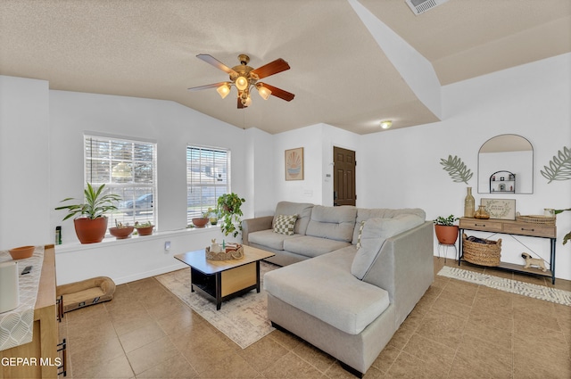 5609 Rick Husband Dr, El Paso, TX 79934 - living area with a ceiling fan, vaulted ceiling, and light tile patterned flooring