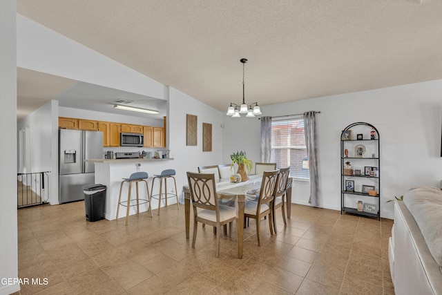 5609 Rick Husband Dr, El Paso, TX 79934 - dining space featuring a chandelier and a textured ceiling