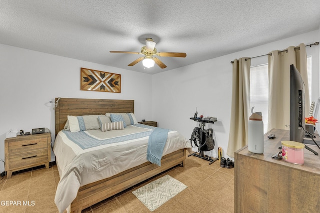 5609 Rick Husband Dr, El Paso, TX 79934 - bedroom featuring a textured ceiling and a ceiling fan