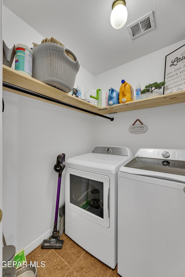 5609 Rick Husband Dr, El Paso, TX 79934 - laundry area with separate washer and dryer and a textured ceiling
