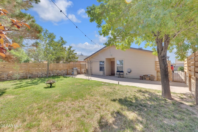 5609 Rick Husband Dr, El Paso, TX 79934 - back of house with an outdoor fire pit, a patio, and a fenced backyard