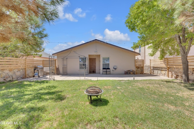 5609 Rick Husband Dr, El Paso, TX 79934 - rear view of property with a patio area, an outdoor fire pit, a fenced backyard, and a gate