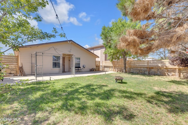5609 Rick Husband Dr, El Paso, TX 79934 - rear view of house with an outdoor fire pit and a patio