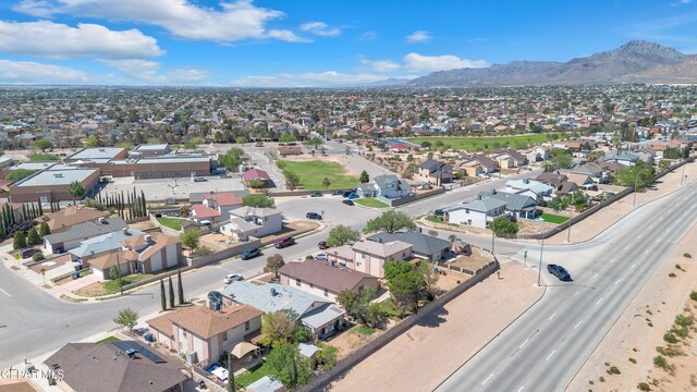 5609 Rick Husband Dr, El Paso, TX 79934 - aerial overview of property's location featuring a mountain backdrop and nearby suburban area