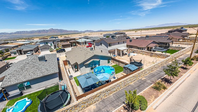 12140 Mesquite Thorn Dr, El Paso, TX 79934 - aerial perspective of suburban area with a pool area and mountains