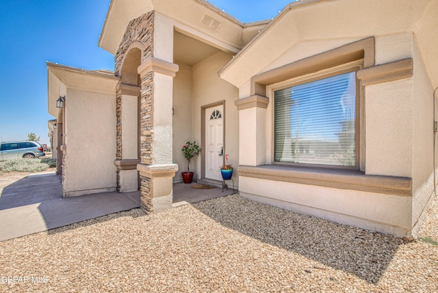 12140 Mesquite Thorn Dr, El Paso, TX 79934 - doorway to property featuring stucco siding