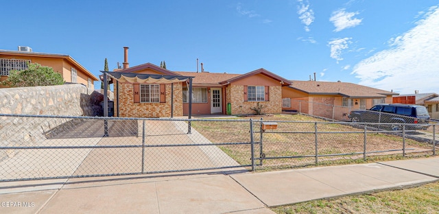 3417 Thomason Ave, El Paso, TX 79904 - ranch-style house featuring brick siding, a gate, and a fenced front yard