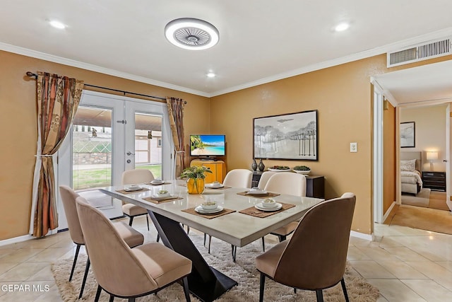 3417 Thomason Ave, El Paso, TX 79904 - dining area featuring light tile patterned floors, french doors, crown molding, and recessed lighting