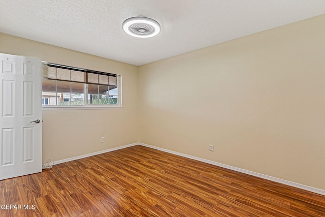 3417 Thomason Ave, El Paso, TX 79904 - spare room with wood finished floors and baseboards
