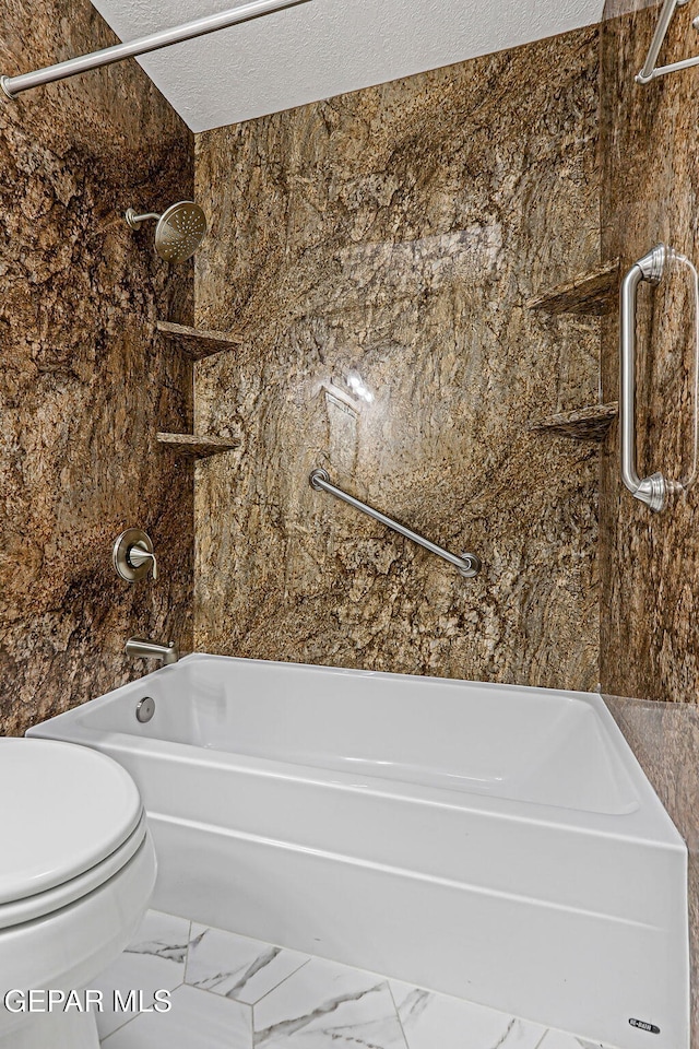 3417 Thomason Ave, El Paso, TX 79904 - full bath featuring  shower combination, marble finish flooring, and a textured ceiling