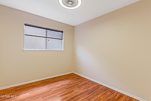 3417 Thomason Ave, El Paso, TX 79904 - unfurnished room with baseboards and wood finished floors