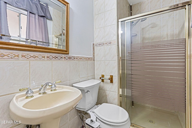 3417 Thomason Ave, El Paso, TX 79904 - full bath with a shower stall, tile walls, and wainscoting