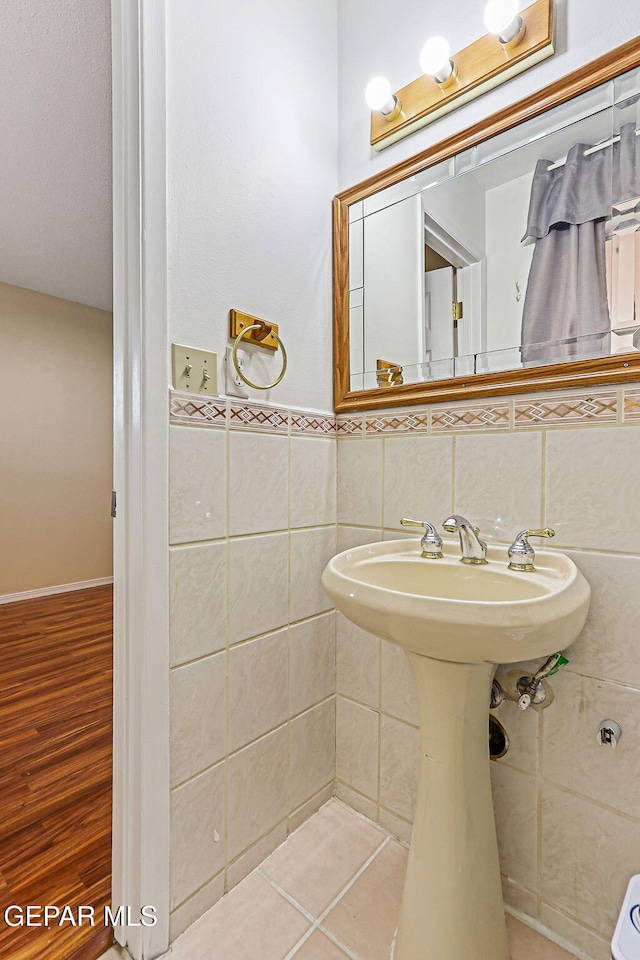 3417 Thomason Ave, El Paso, TX 79904 - bathroom with tile walls and wood finished floors