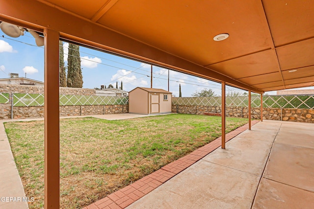 3417 Thomason Ave, El Paso, TX 79904 - fenced backyard featuring a patio area and a storage shed