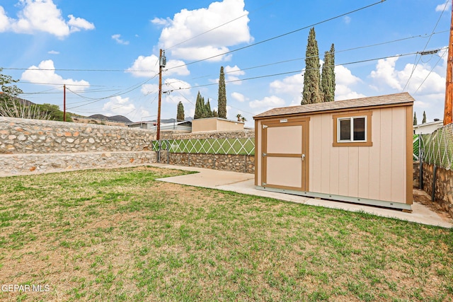 3417 Thomason Ave, El Paso, TX 79904 - fenced backyard featuring a storage unit