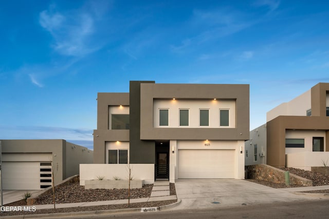1837 Bridle, El Paso, TX 79911 - contemporary house featuring stucco siding, concrete driveway, and a garage