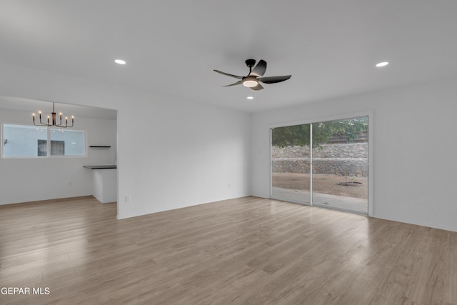 10113 Shenandoah St, El Paso, TX 79924 - unfurnished room with a chandelier, ceiling fan, light wood-type flooring, and recessed lighting