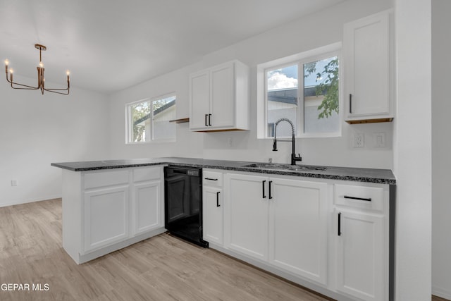 10113 Shenandoah St, El Paso, TX 79924 - kitchen featuring black dishwasher, white cabinets, a chandelier, a peninsula, and dark stone countertops