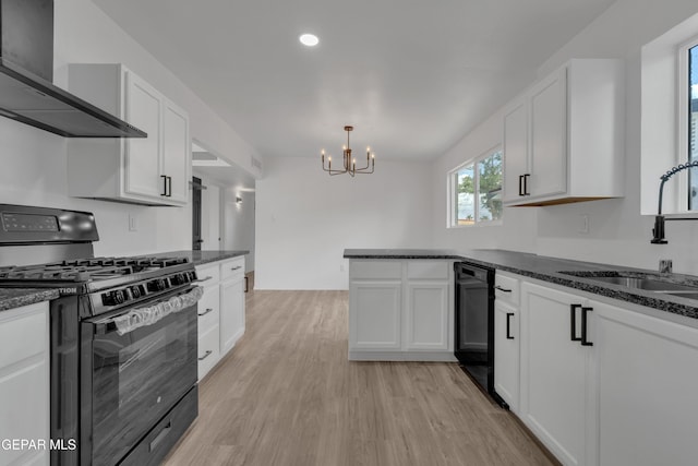 10113 Shenandoah St, El Paso, TX 79924 - kitchen with black appliances, wall chimney exhaust hood, a chandelier, light wood-style floors, and white cabinets
