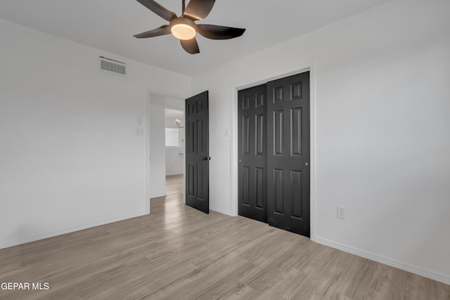 10113 Shenandoah St, El Paso, TX 79924 - unfurnished bedroom with light wood-style flooring, a closet, and a ceiling fan