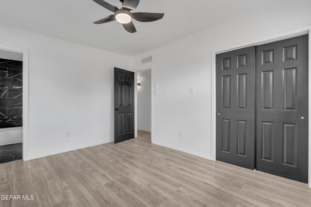 10113 Shenandoah St, El Paso, TX 79924 - unfurnished bedroom featuring a closet, light wood-style flooring, and a ceiling fan