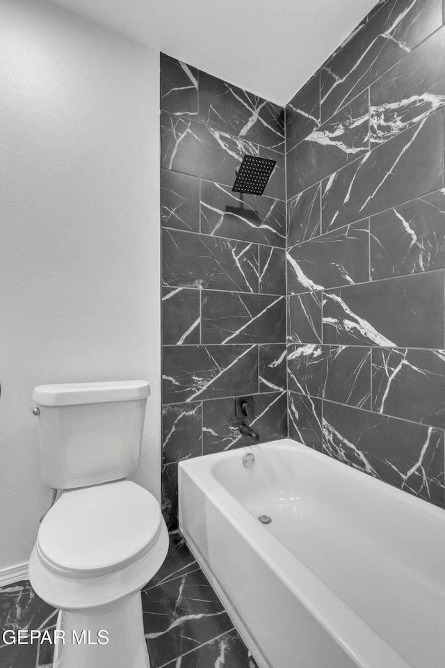 10113 Shenandoah St, El Paso, TX 79924 - full bathroom featuring marble look tiles and bathing tub / shower combination