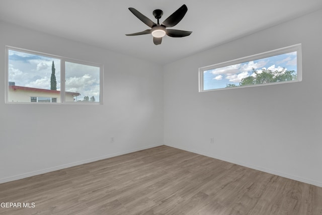 10113 Shenandoah St, El Paso, TX 79924 - empty room with light wood finished floors and a ceiling fan
