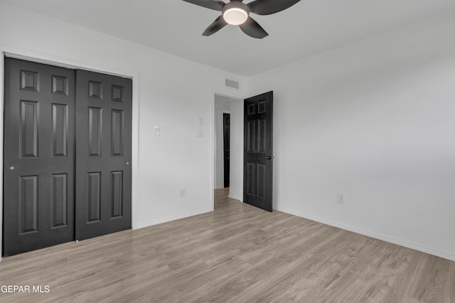 10113 Shenandoah St, El Paso, TX 79924 - unfurnished bedroom with light wood-style flooring, a closet, and a ceiling fan