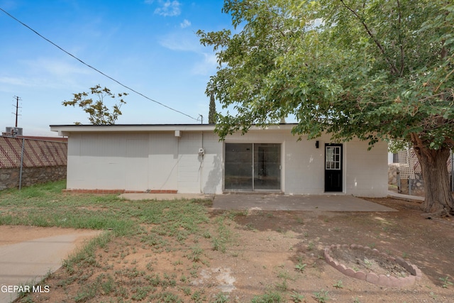 10113 Shenandoah St, El Paso, TX 79924 - back of property featuring concrete block siding and a patio