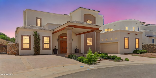 6514 Franklin Cove Place, El Paso, TX 79912 - mediterranean / spanish-style home with stucco siding, driveway, a garage, and a tile roof