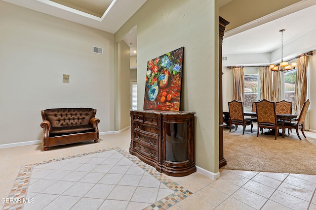 6514 Franklin Cove Place, El Paso, TX 79912 - sitting room with light carpet, light tile patterned floors, and a chandelier