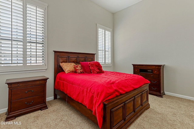 6514 Franklin Cove Place, El Paso, TX 79912 - bedroom featuring light carpet and multiple windows