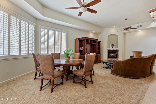 6514 Franklin Cove Place, El Paso, TX 79912 - dining room with a ceiling fan, a tile fireplace, recessed lighting, and light colored carpet