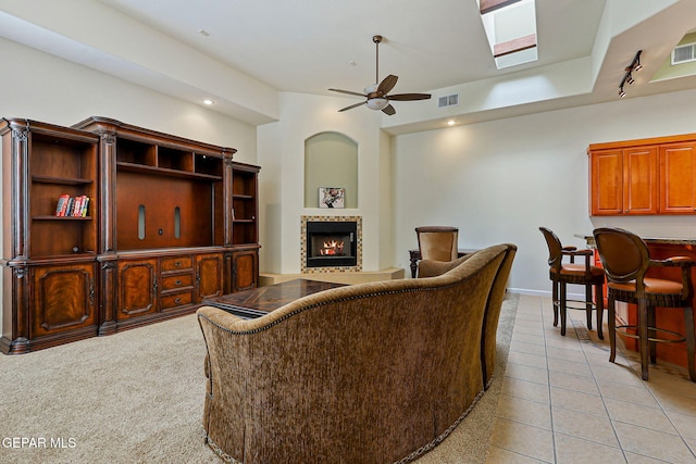 6514 Franklin Cove Place, El Paso, TX 79912 - living area with a ceiling fan, a lit fireplace, light tile patterned floors, and recessed lighting
