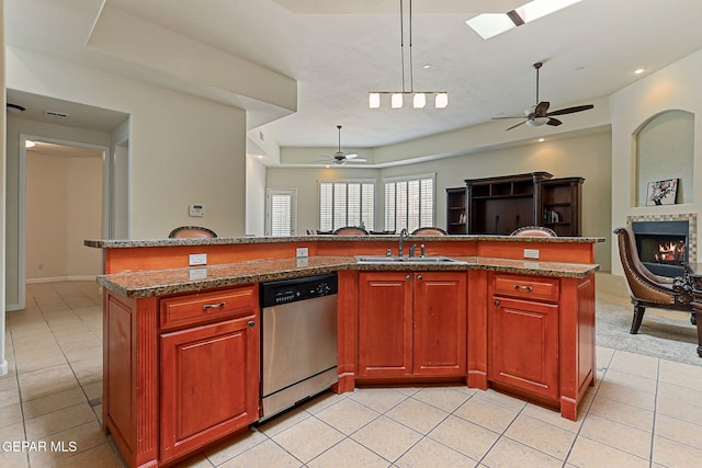 6514 Franklin Cove Place, El Paso, TX 79912 - kitchen featuring dishwasher, open floor plan, a ceiling fan, light tile patterned flooring, and a kitchen island with sink