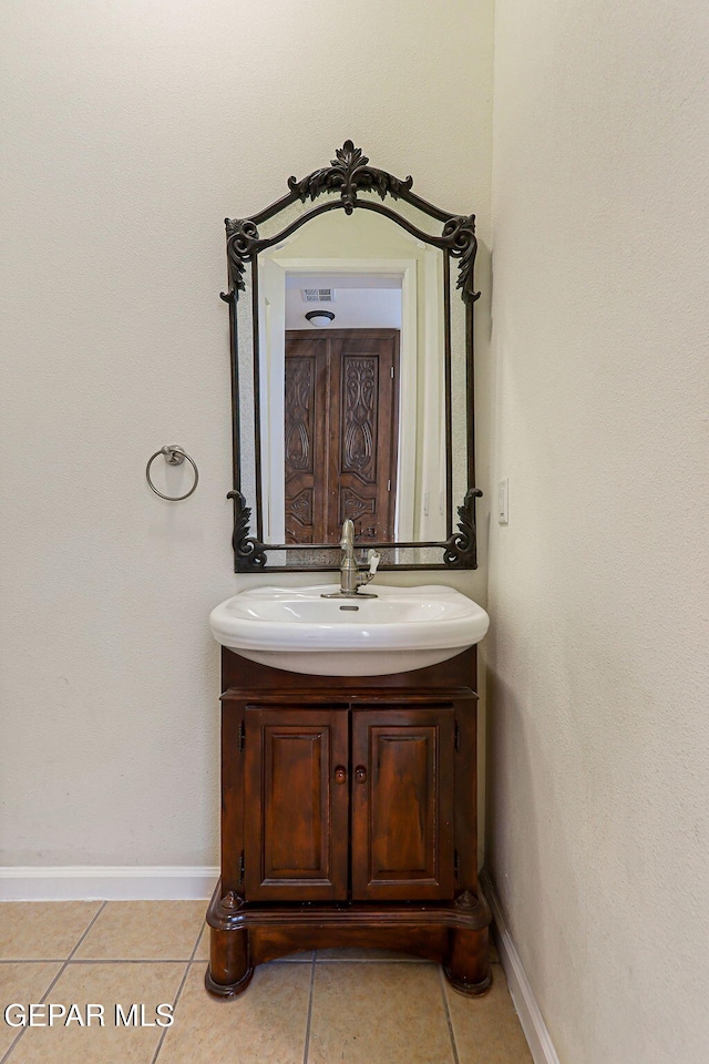 6514 Franklin Cove Place, El Paso, TX 79912 - bathroom with tile patterned floors and vanity