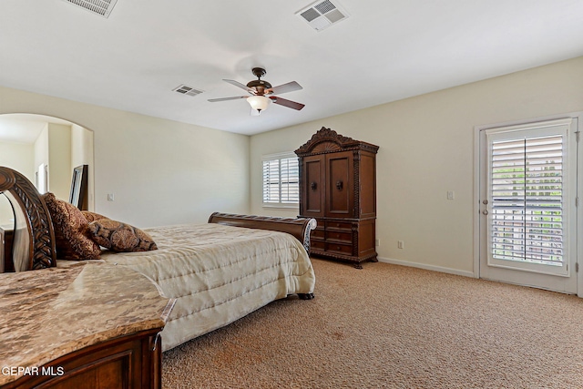 6514 Franklin Cove Place, El Paso, TX 79912 - bedroom with light carpet, access to exterior, a ceiling fan, and arched walkways