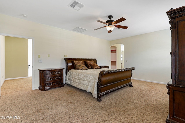 6514 Franklin Cove Place, El Paso, TX 79912 - bedroom featuring arched walkways, light carpet, and a ceiling fan