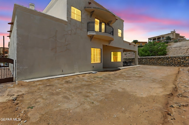 6514 Franklin Cove Place, El Paso, TX 79912 - rear view of property featuring a balcony, a patio, and stucco siding