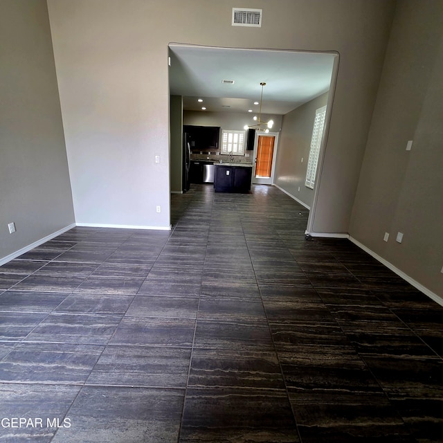 14368 Angel D Garcia Ct, El Paso, TX 79938 - unfurnished living room featuring baseboards