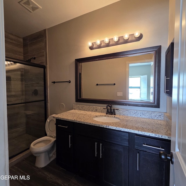 14368 Angel D Garcia Ct, El Paso, TX 79938 - full bath with vanity, a shower stall, and wood finished floors