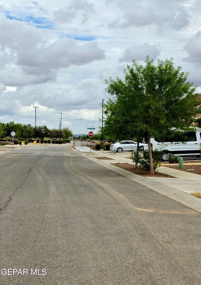 14368 Angel D Garcia Ct, El Paso, TX 79938 - view of asphalt street featuring traffic signs