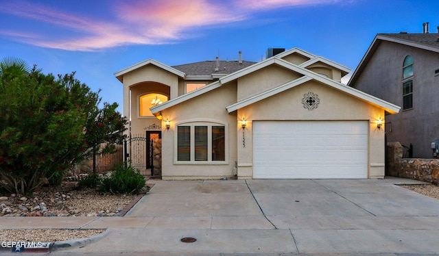 11353 W Ranch Ct, El Paso, TX 79934 - view of front of house with stucco siding, an attached garage, concrete driveway, and a gate