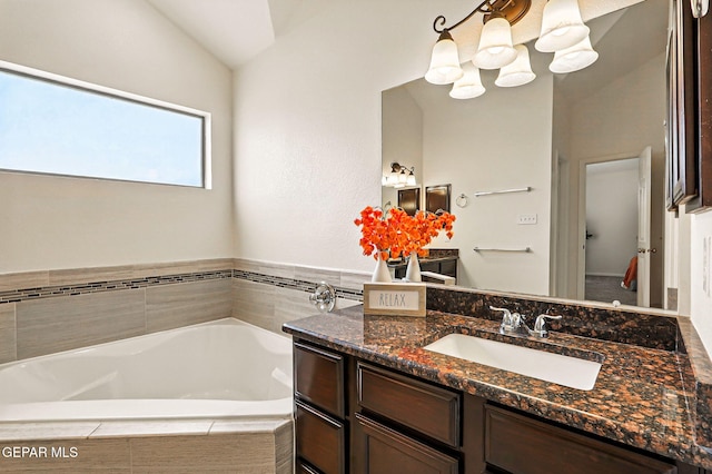 11353 W Ranch Ct, El Paso, TX 79934 - bathroom with a bath, vanity, vaulted ceiling, and a chandelier