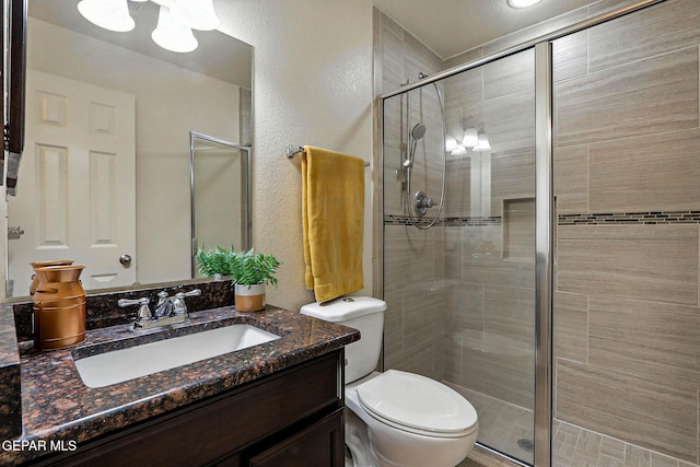 11353 W Ranch Ct, El Paso, TX 79934 - bathroom with a stall shower, vanity, a textured wall, and a chandelier