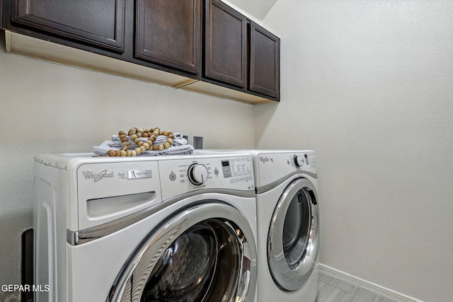 11353 W Ranch Ct, El Paso, TX 79934 - laundry area featuring cabinet space and washer and clothes dryer