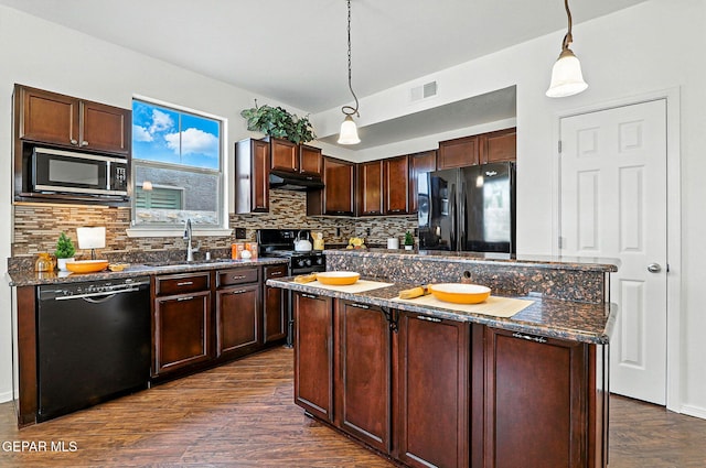 11353 W Ranch Ct, El Paso, TX 79934 - kitchen with black appliances, dark wood-style floors, tasteful backsplash, a center island, and dark stone counters