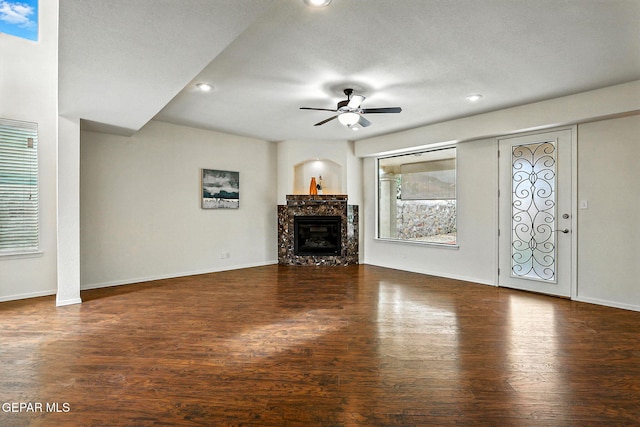 11353 W Ranch Ct, El Paso, TX 79934 - unfurnished living room featuring a ceiling fan, wood finished floors, a premium fireplace, and recessed lighting